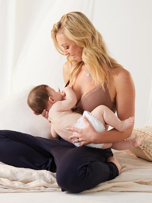 Nursing mom with baby in lifestyle image