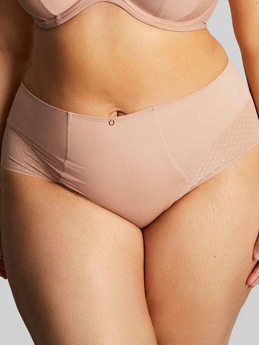 Beige underwear worn by a person on a neutral background