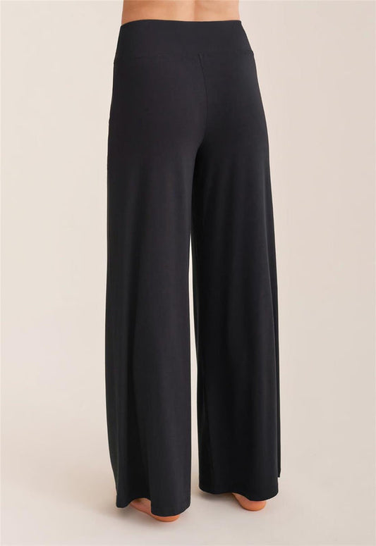 Black wide-leg pants on a neutral background