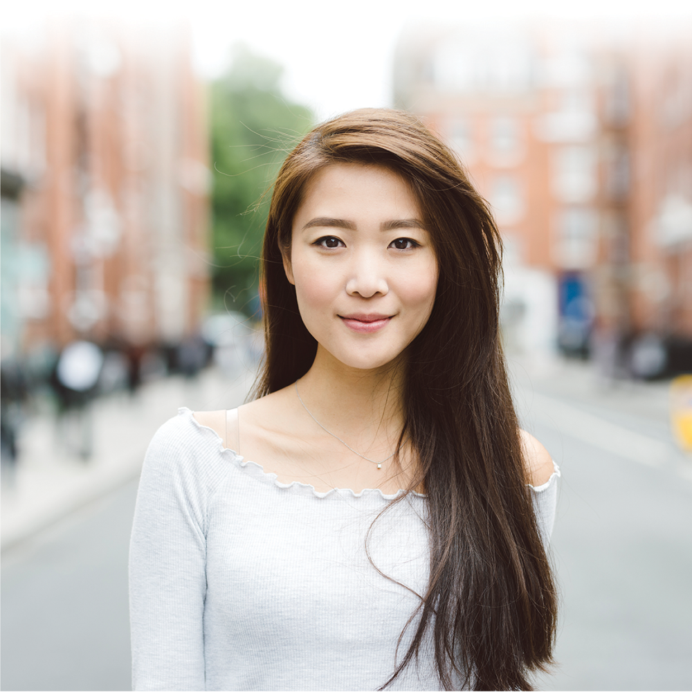 Woman wearing clear straps with a wide neck top
