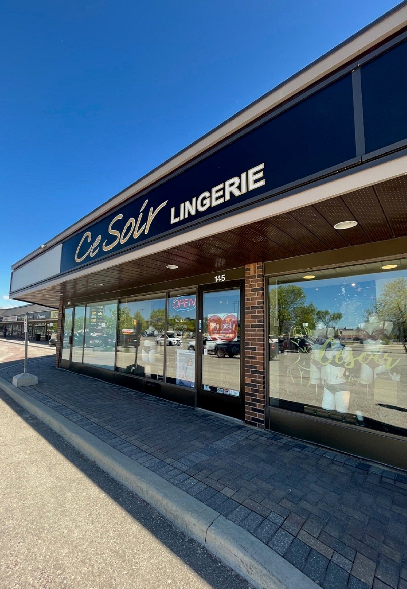 Image of Ce Soir Lingerie storefront with open sign on