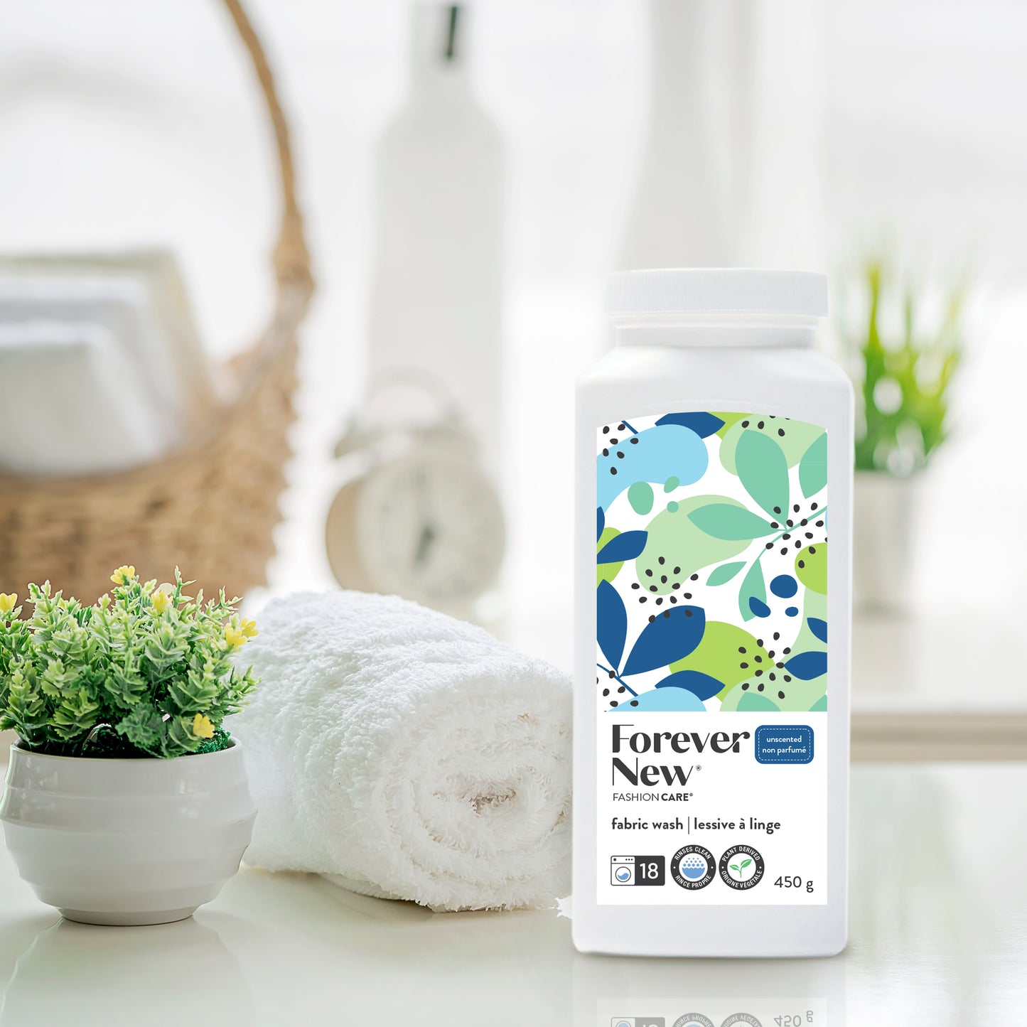 Forever New Powder Medium Fabric Wash Unscented next to folded towel on a counter