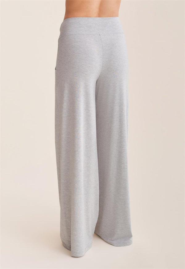 Light gray wide-leg pants on a beige background