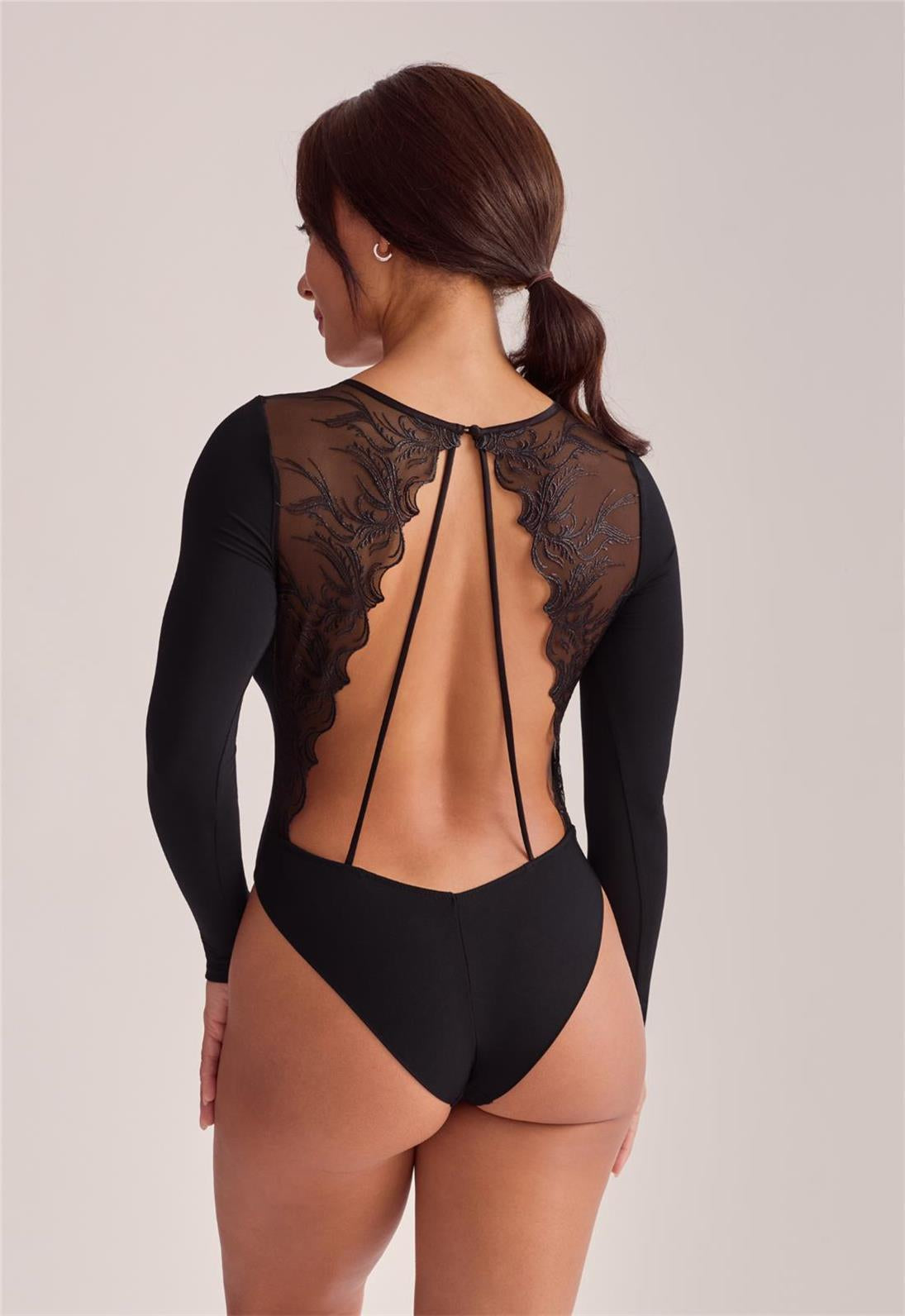 Model wears the Desire Bodysuit back view