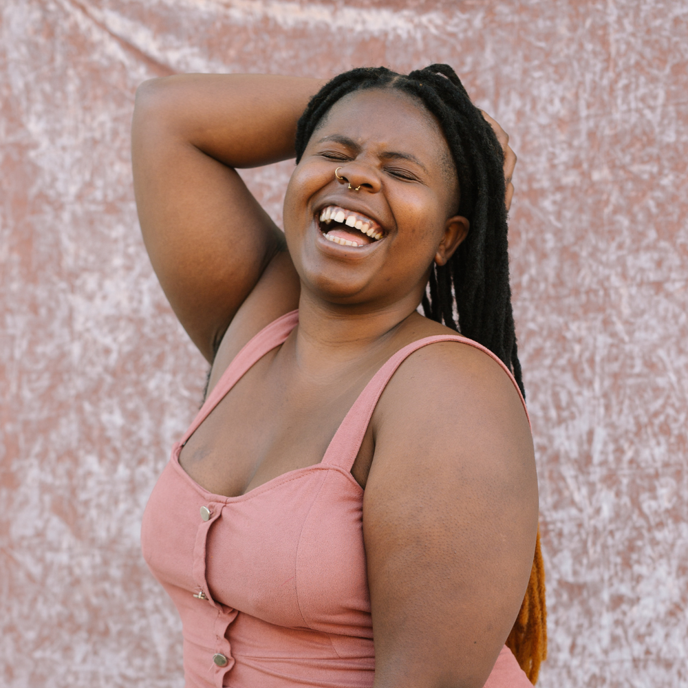 Lifestyle image of a woman wearing a square neck top