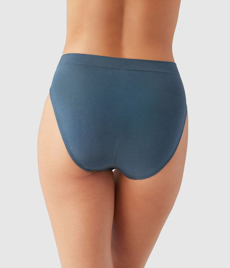 Teal underwear on a plain background