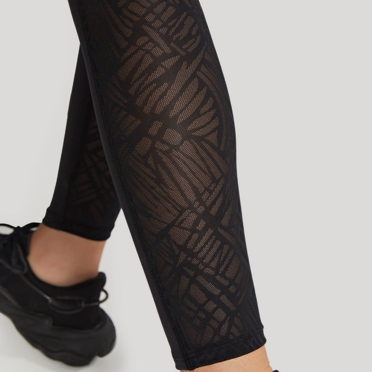 Ultra Adapt Sports Legging - Black worn by model close up back leg view