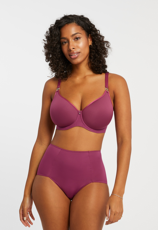 Model wearing the Smoothing Brief and Sublime Spacer set in cranberry