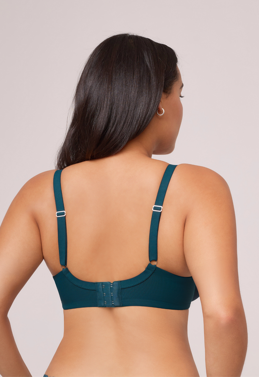 Model wearing the Sublime Spacer T-Shirt Bra in Deep Spruce, showing straps and back closure.