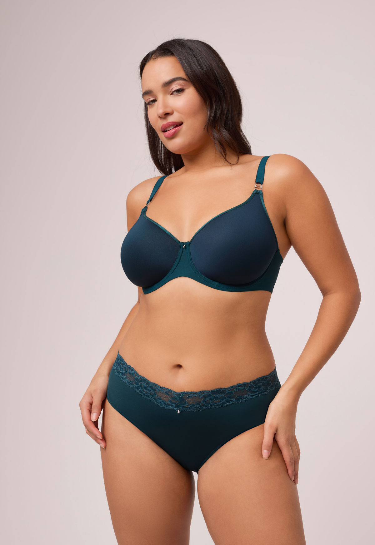 A model wearing the Sublime Spacer T-Shirt Bra in Deep Spruce with matching lace-trim briefs.