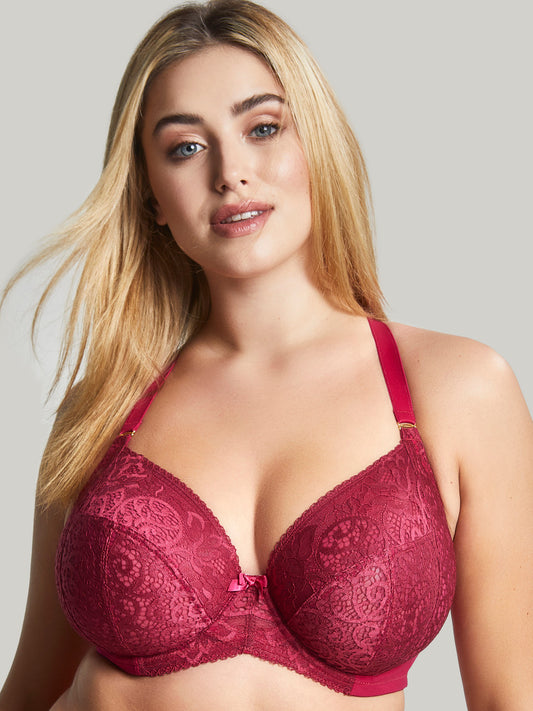 Model is wearing the Sculptresse Estel Plunge bra in Berry - front halter strap view.