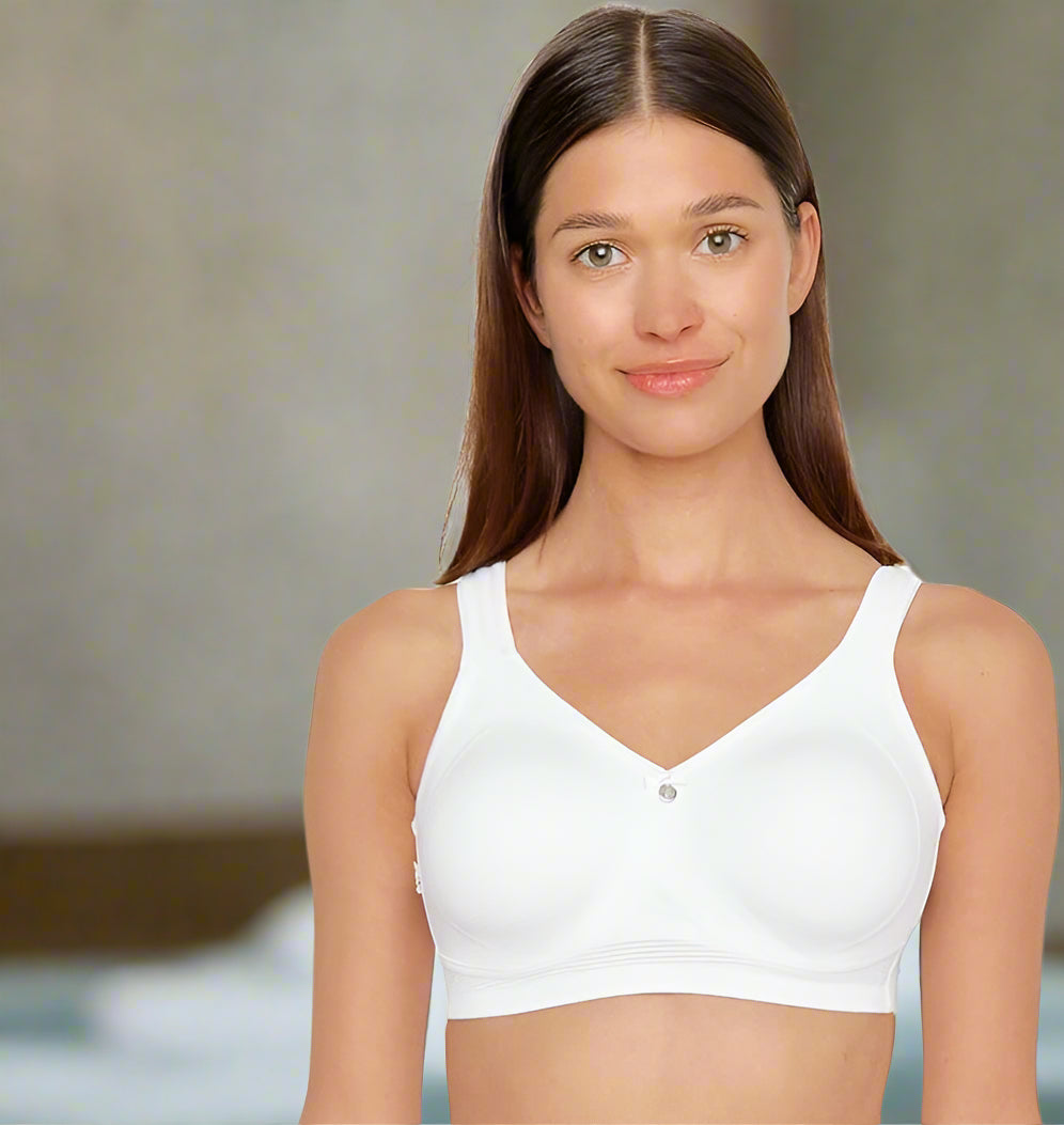 Capri Wireless Bra in White worn by model front view at a spa