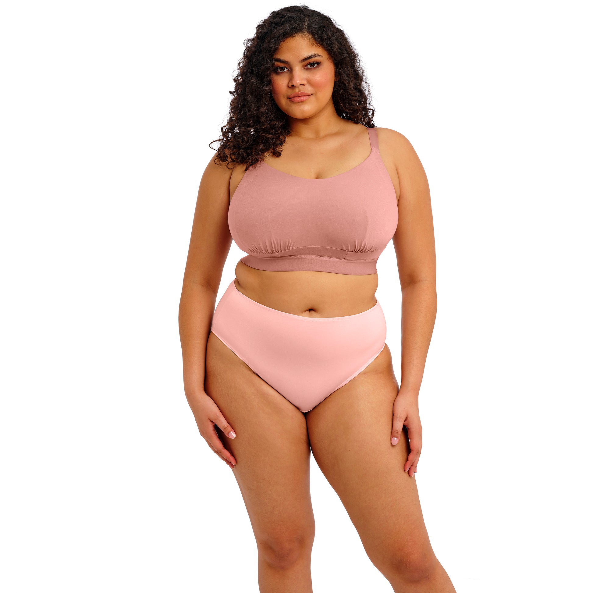 Full Body front view of Model wearing the downtime bralette in ash rose on a white background
