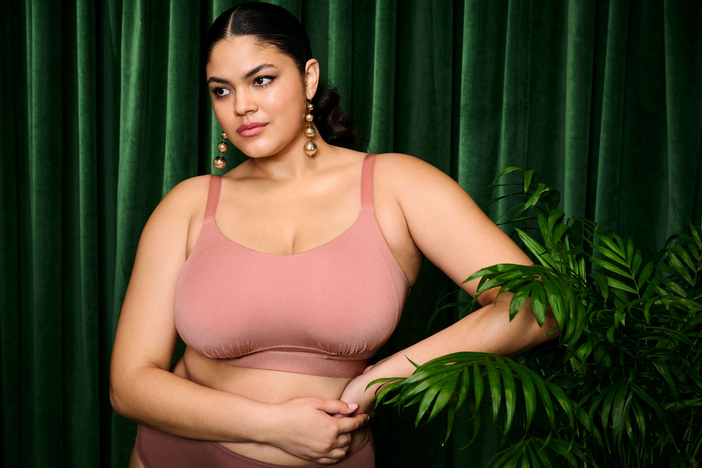 Lifestyle Image of Model wearing the downtime bralette in ash rose 
