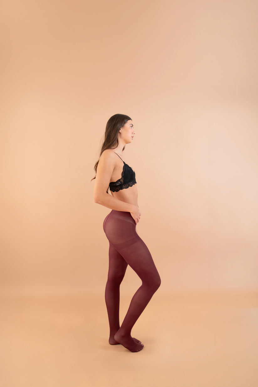 The Bordeaux Tights worn by model side view