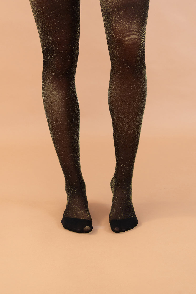 The Champagne Shimmer Tights worn by model front view