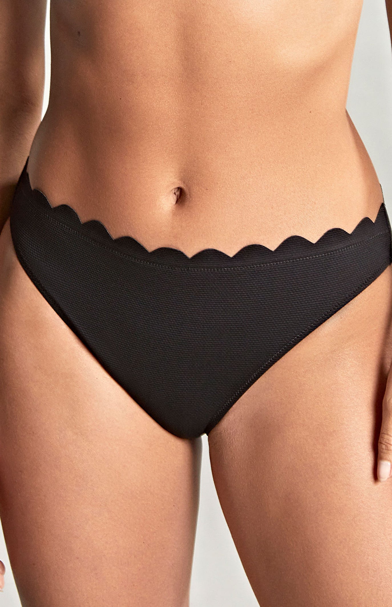 Spirit Classic Brief Bikini Bottom in Black worn by model front view