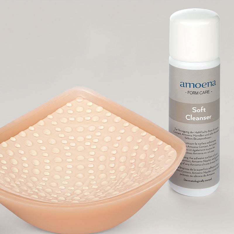 Amoena Soft Cleanser next to a contact adhesive breast form
