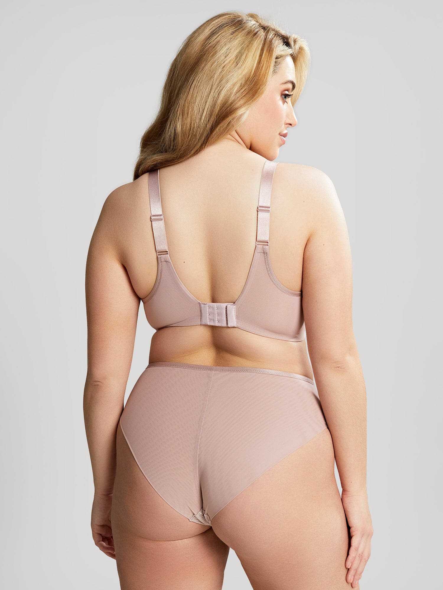 Model wears Illuminate t-shirt bra and deep brief in a back torso shot.