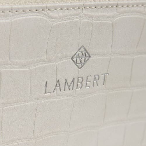 Meli Vegan Leather Wallet - Vanilla Croco close up view of Lambert logo