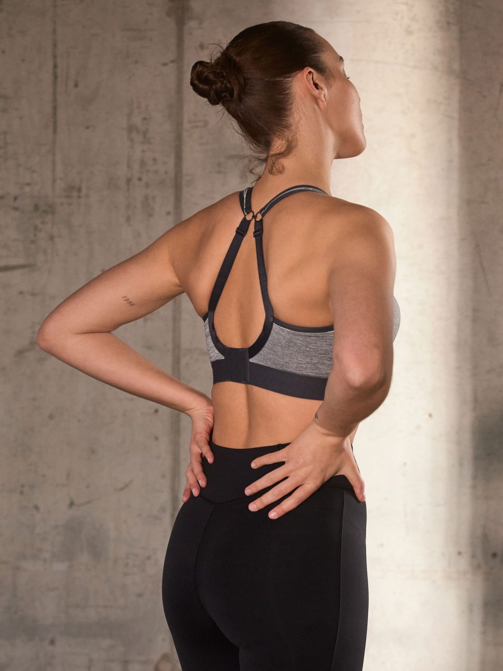 Non Wired Sports Bra - Charcoal Marl worn by model lifestyle image