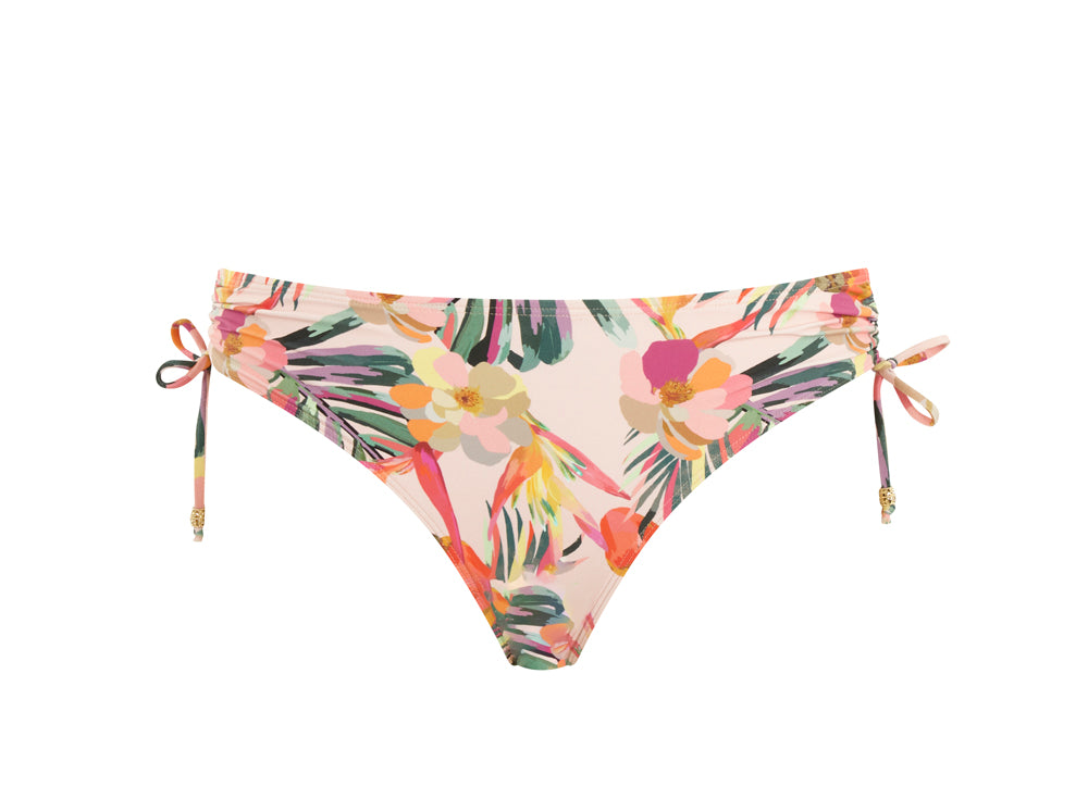 The Paradise Midi Tie Side Pant in pink tropical. Close up product shot in front view.