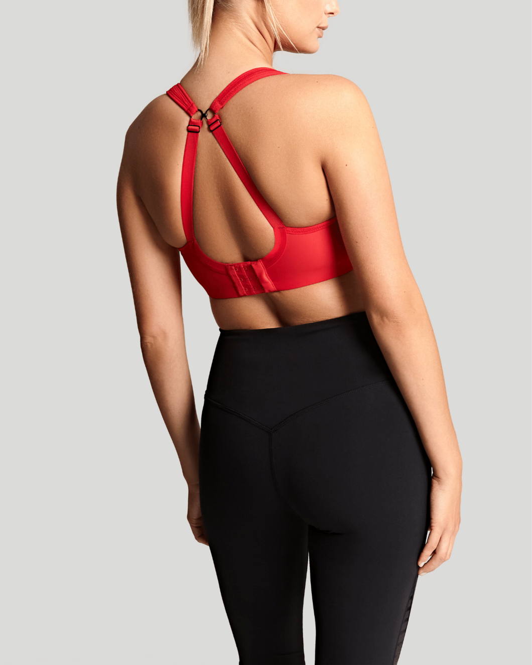 Panache Wired Sports Bra in Fiery Red, worn by model in back view product image demonstrating convertible straps.Panache Wired Sports Bra - Fiery Red worn by model back view