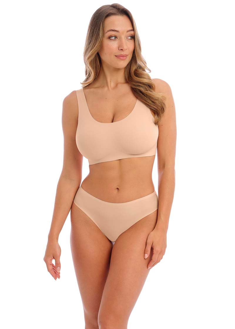 Smoothease Invisible Stretch Thong - Natural Beige, worn by model front view